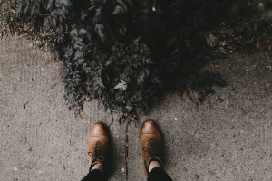 Feet Standing on Pavement