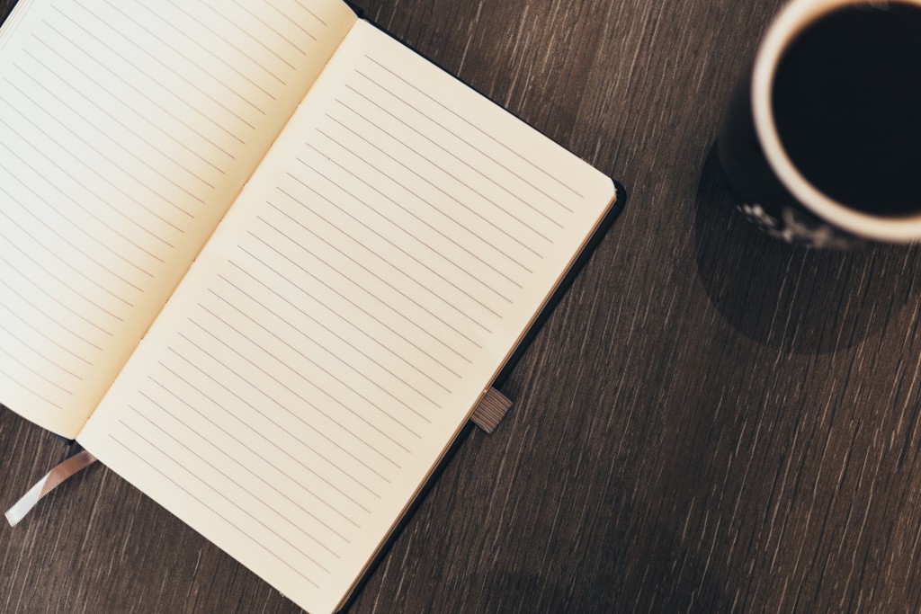 notebook and cup of coffee