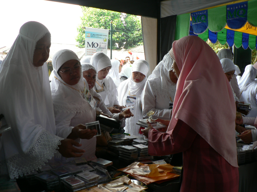 Women buying cassette tapes.